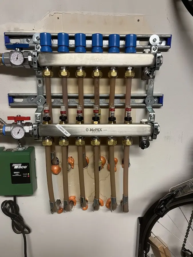 Plumber performing Water Heater Repair at a residential property in Trotwood